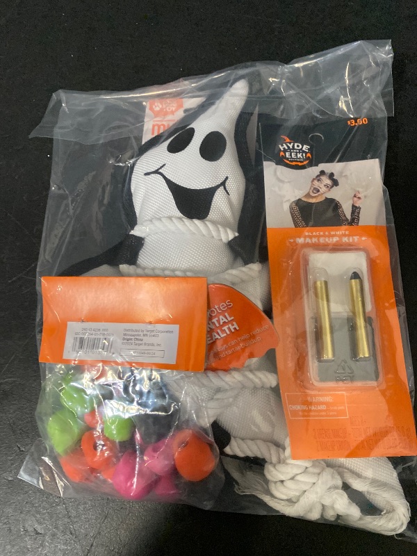Photo 1 of 3 Item Seasonal & Party Supplies Bundle | 24ct Halloween Party Favors Skull Erasers, Halloween Ghost Cross Dog Interactive Plush Toy, Black/White Palette and Crayons