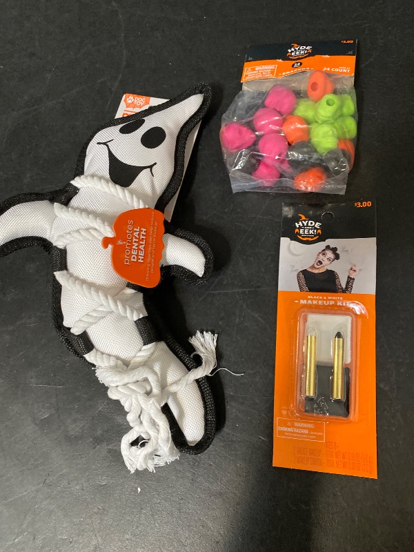 Photo 1 of 3 Item Seasonal & Party Supplies Bundle | 24ct Halloween Party Favors Skull Erasers, Halloween Ghost Cross Dog Interactive Plush Toy, Black/White Palette and Crayons