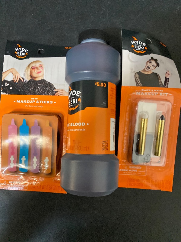 Photo 1 of 3 Item Seasonal & Party Supplies Bundle | 16 OZ. Fake Blood, 4 CT. Neon Makeup Sticks, Black/White Makeup Kit