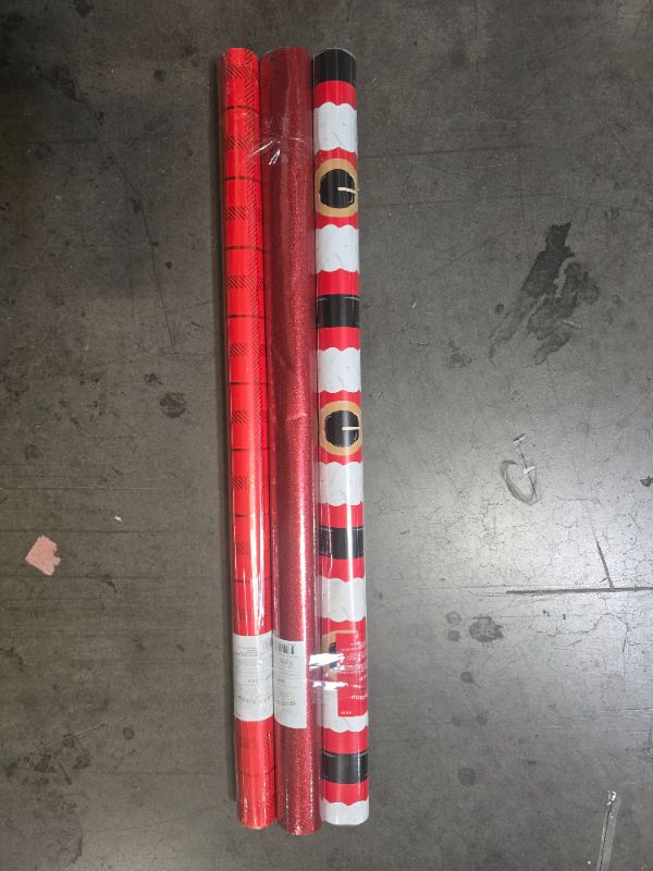 Photo 1 of 3 Pack Red Gift Wrapping Paper - Santa Belt 50Sq Ft , Plaid  25 Sq Ft , Glittered  20 Sq Ft