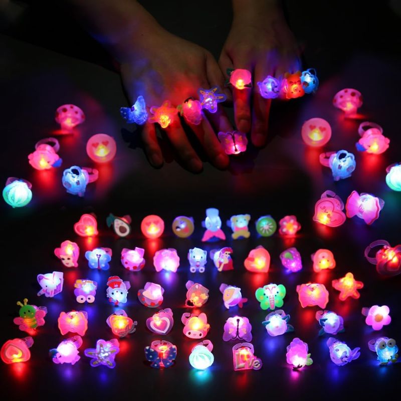 Photo 1 of 50 Pcs LED Light Up Ring Bulk Toys, Glow in The Dark Party Supplies, Party Favors for Adults Kids Pinata Filler Goody Bag Stuffers Random Patterns