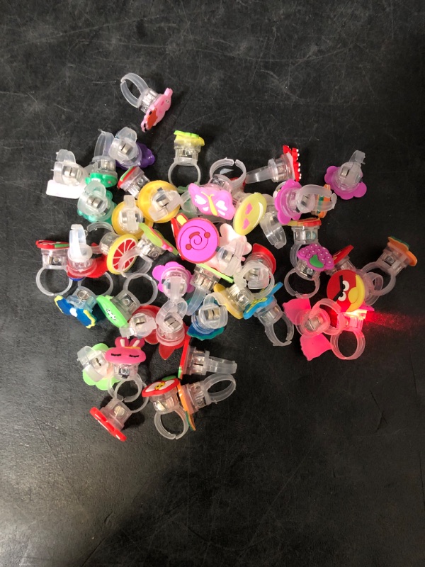 Photo 1 of 50 Pcs LED Light Up Ring Bulk Toys, Glow in The Dark Party Supplies, Party Favors for Adults Kids Pinata Filler Goody Bag Stuffers Random Patterns