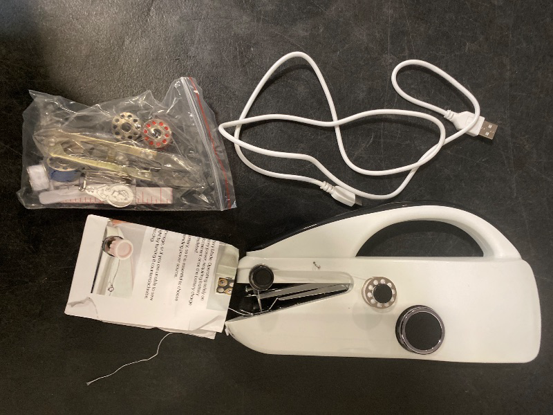 Photo 1 of Handheld Sewing Machine, Portable Electric Mini Sewing Machine Two Speeds Manual Small Hand Held Sewing Device, Quick Repairs Stitching Kit for Beginners Adults DIY Home Travel