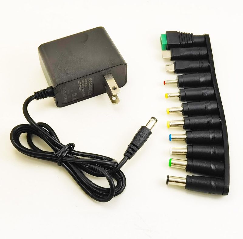 Photo 1 of 12V 1A 0.8A 0.5A Power Supply Adapter 12W AC DC Adapter with 5.5 x 2.1mm Plug and 9 Interchangeable Jacks Plug for LED Strip Light BT Speaker GPS Webcam Router etc