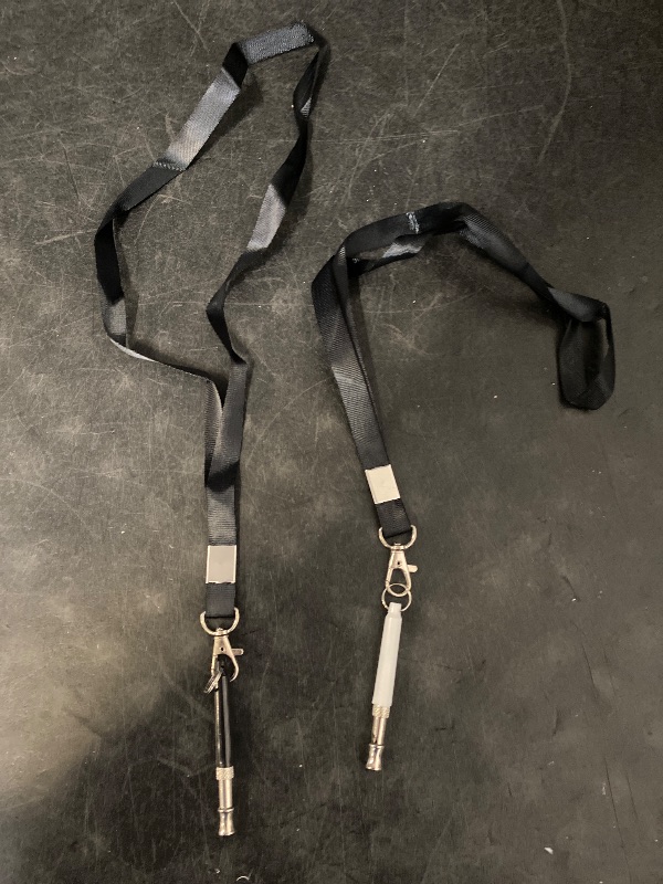 Photo 1 of Professional Dog Training Whistle Set, 2 Pack with Lanyards Ultrasonic Silent Recall Whistles Black and White
