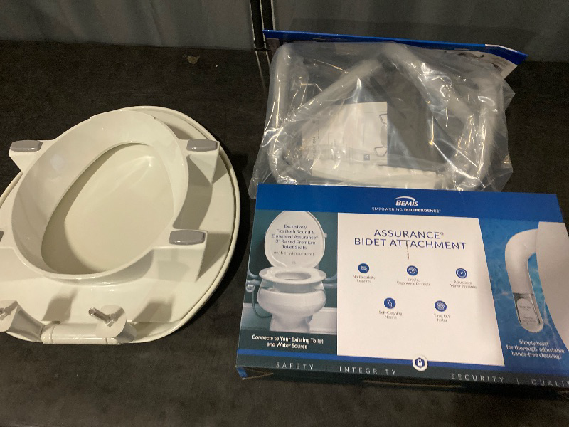 Photo 1 of Bemis Assurance 3" Raised Toilet Seat with Handles and Bidet Attachment, Secure Hinges, Clean Shield Guard, Elongated, White