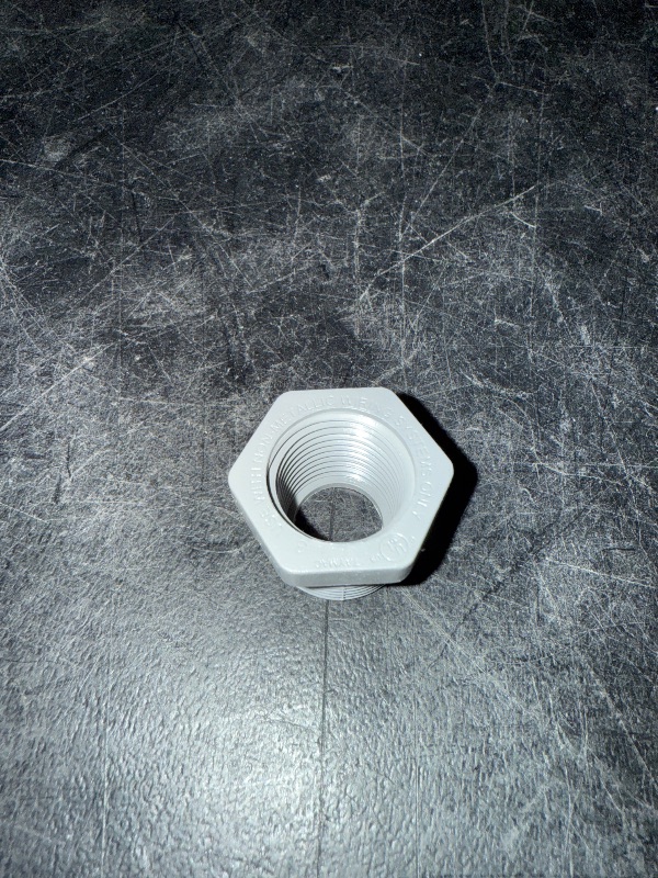 Photo 1 of 3/4" Male x 1/2" Female Threaded Reducer Bushing for PVC Pipe Fitting (Pack of 7)  with Carlon E940d-ctn Pvc Conduit Coupling, 1/2"