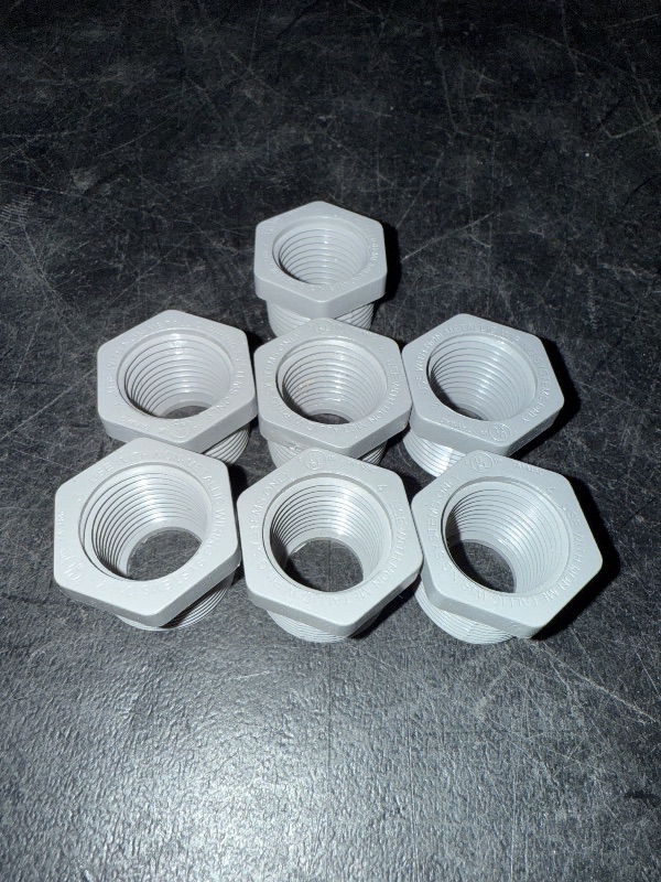 Photo 1 of 3/4" Male x 1/2" Female Threaded Reducer Bushing for PVC Pipe Fitting (Pack of 7)  with Carlon E940d-ctn Pvc Conduit Coupling, 1/2"