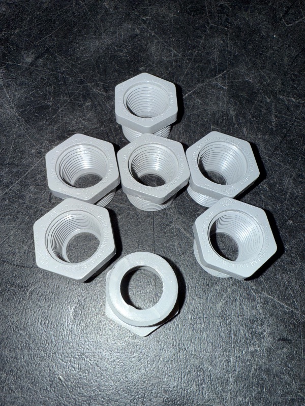 Photo 1 of 3/4" Male x 1/2" Female Threaded Reducer Bushing for PVC Pipe Fitting (Pack of 7)  with Carlon E940d-ctn Pvc Conduit Coupling, 1/2"