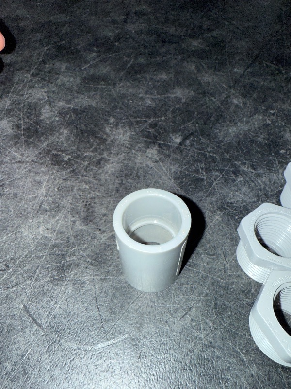 Photo 1 of 3/4" Male x 1/2" Female Threaded Reducer Bushing for PVC Pipe Fitting (Pack of 7)  with Carlon E940d-ctn Pvc Conduit Coupling, 1/2"