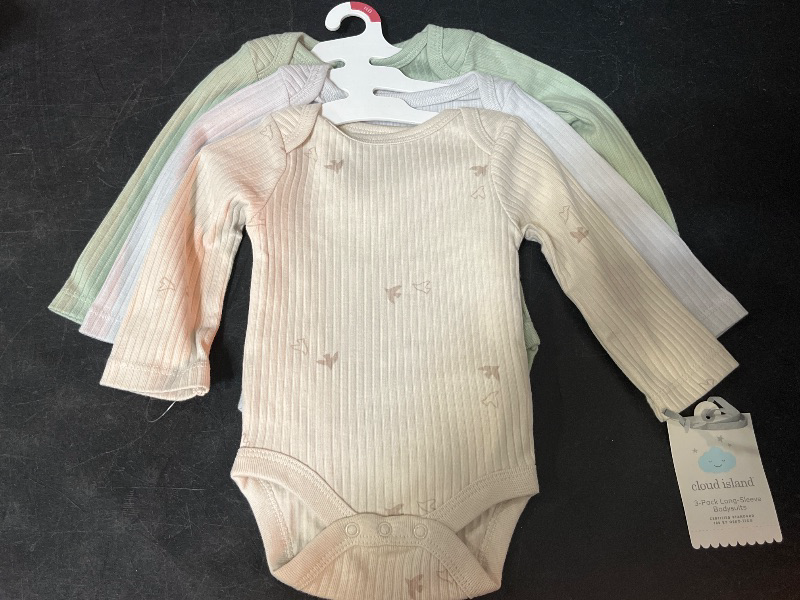 Photo 1 of NB Baby 3pk Solid Long Sleeve Wide Ribbed Bodysuit - Cloud Island™ Newborn: Cotton, Midweight, Crotch Snap, Lap Shoulder