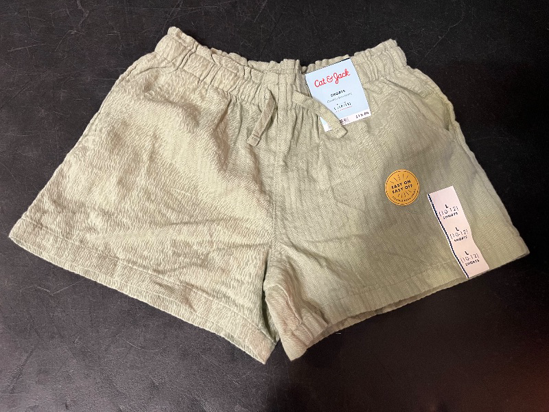 Photo 1 of L Girls' Woven Shorts - Cat & Jack™ Light Olive L: 100% Cotton, Lightweight, Mid Rise, Elastic Waist, Side Pocket, Machine Washable
