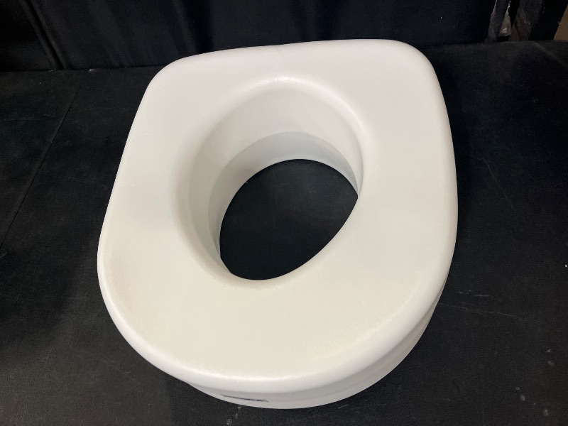 Photo 1 of Carex Toilet Seat Riser, Elongated Raised Toilet Seat Adds 3.5 inches to Toilet Height, for Assistance Bending or Sitting, 300 Pound Weight Capacity Toilet Riser