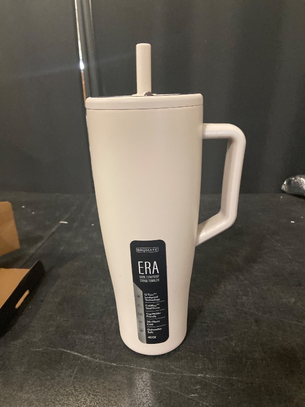 Photo 1 of BrüMate Era 40 oz Tumbler with Handle and Straw | 100% Leakproof Insulated Water Bottle Tumbler with Lid and Flexible SoftSip Straw | Made of Stainless Steel | Cup Holder Friendly | 40oz (Dune)