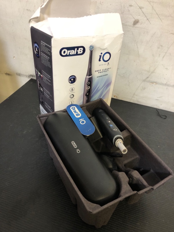 Photo 1 of Oral-B iO Deep Clean + Protect Rechargeable Electric Toothbrush, Black with a iO Series 7 Toothbrush, 2 Replacement Brush Heads, and a Charging Travel Case