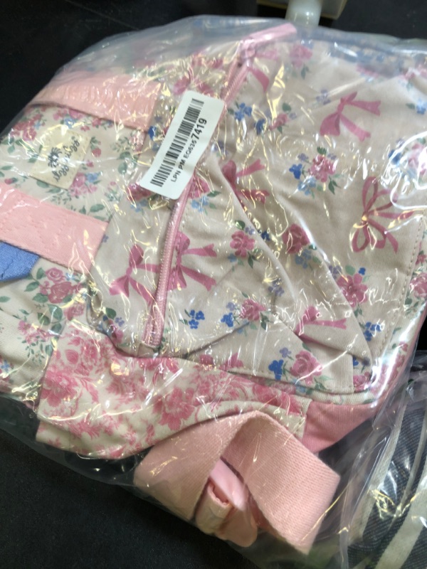 Photo 1 of Itzy Ritzy Toddler Backpack - Daycare Bag - Features Adjustable Shoulder Straps, 2 Side Pockets & Spacious Interior with Wipeable Fabric Lining & Name Label, Ribbons & Roses Backpack