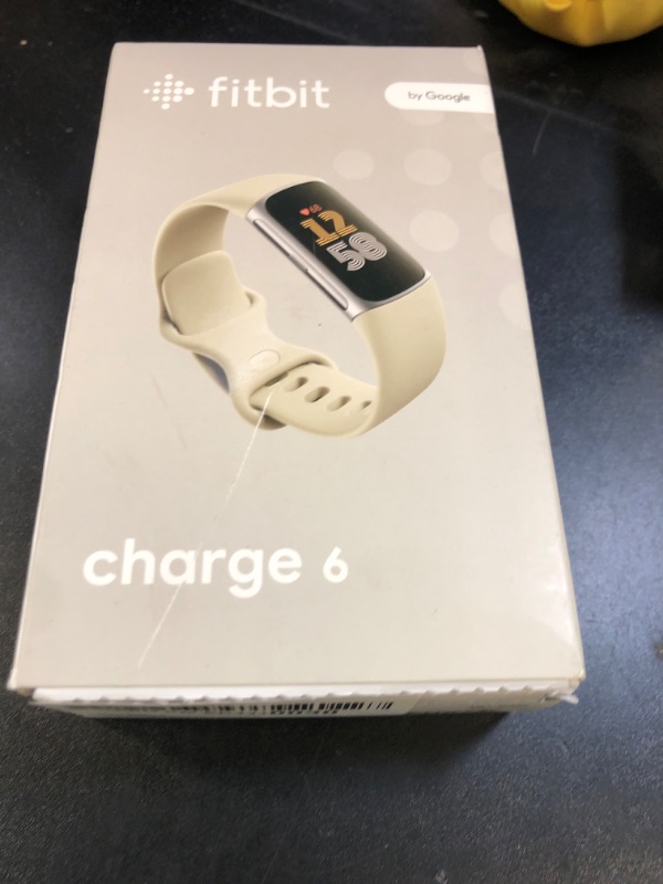 Photo 1 of Fitbit Charge 6 Fitness Tracker with Google apps, Heart Rate on Exercise Equipment, 6-Months Premium Membership Included, GPS, Health Tools and More, Porcelain/Silver, One Size (S & L Bands Included)