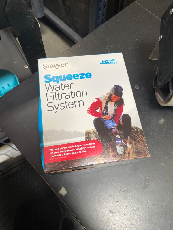 Photo 1 of Sawyer Products SP129 Squeeze Water Filtration System w/ Two 32-Oz Squeeze Pouches, Straw, and Hydration Pack Adapter