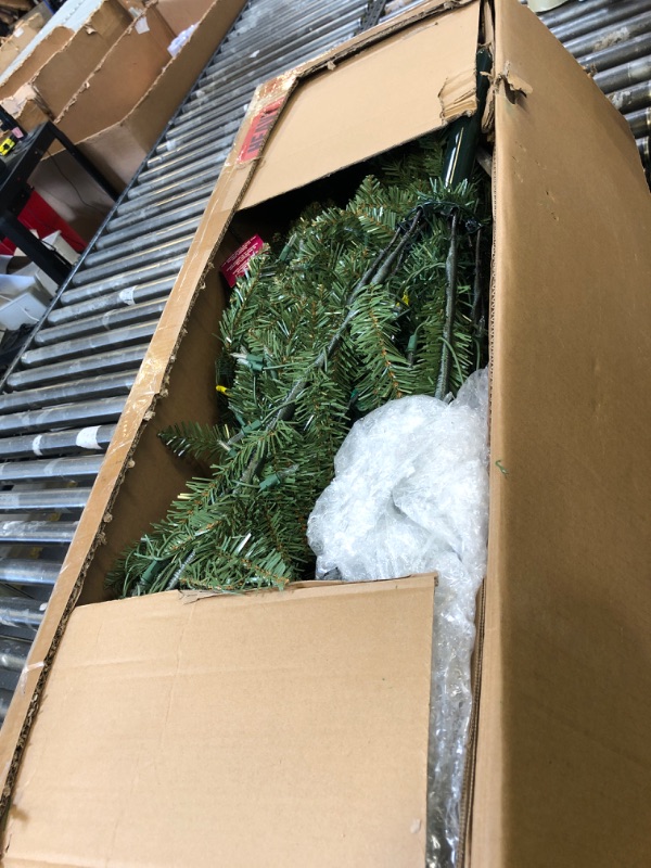 Photo 1 of National Tree Company Pre-Lit Artificial Full Christmas Tree, Green, Dunhill Fir, White Lights, Includes Stand, 6.5 Feet