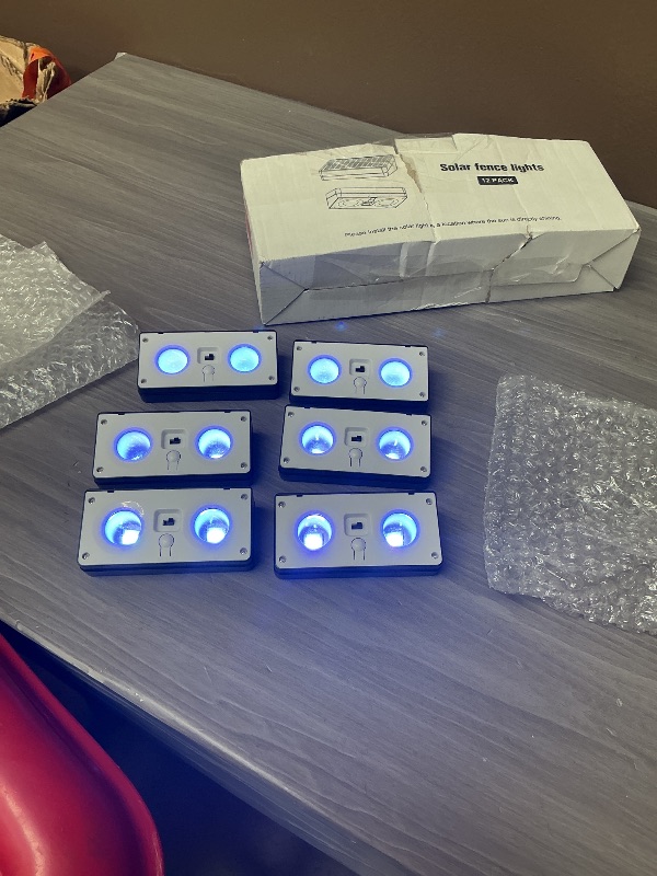 Photo 1 of JOFIOS Solar Fence Lights 12 Pack, 50 Lumens Outdoor Fence Solar Lights with 12 Modes RGB Color Glow LED Solar Lights Outdoor Waterproof, Solar Lights for Patio, Backyard, Deck, Fence, Railing.