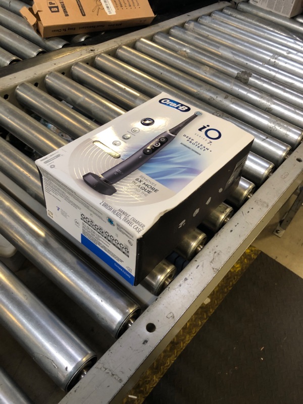 Photo 1 of Oral-B iO Deep Clean + Protect Rechargeable Electric Toothbrush, Black with a iO Series 7 Toothbrush, 2 Replacement Brush Heads, and a Charging Travel Case