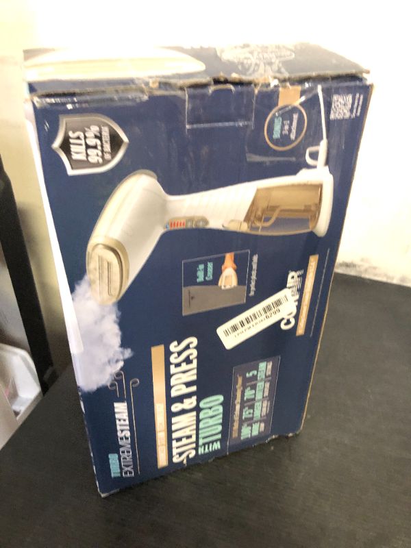 Photo 1 of Conair Handheld Garment Steamer for Clothes, Turbo ExtremeSteam 1875W, Portable Handheld Design, Strong Penetrating Steam, White / Champagne