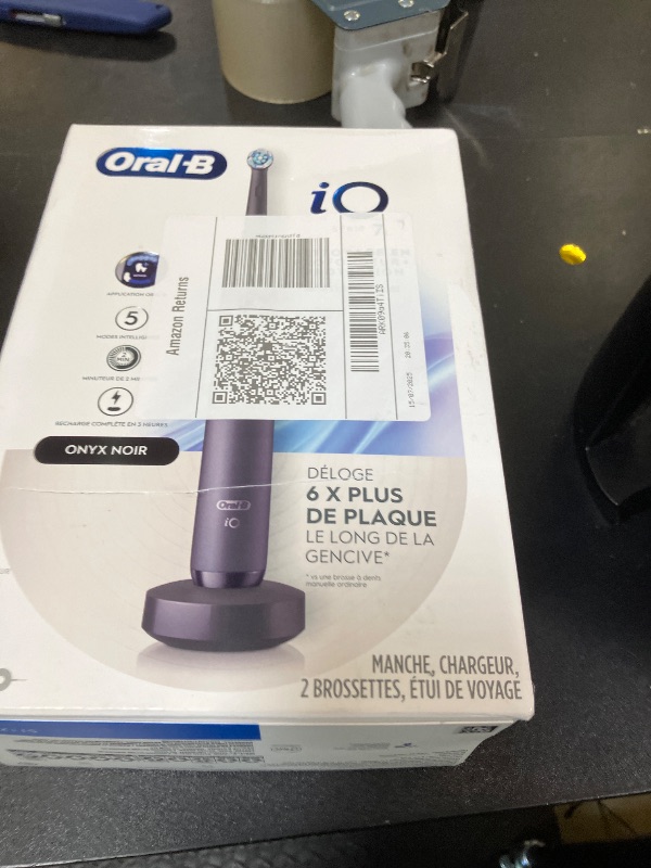 Photo 1 of Oral-B iO Deep Clean + Protect Rechargeable Electric Toothbrush, Black with a iO Series 7 Toothbrush, 2 Replacement Brush Heads, and a Charging Travel Case
