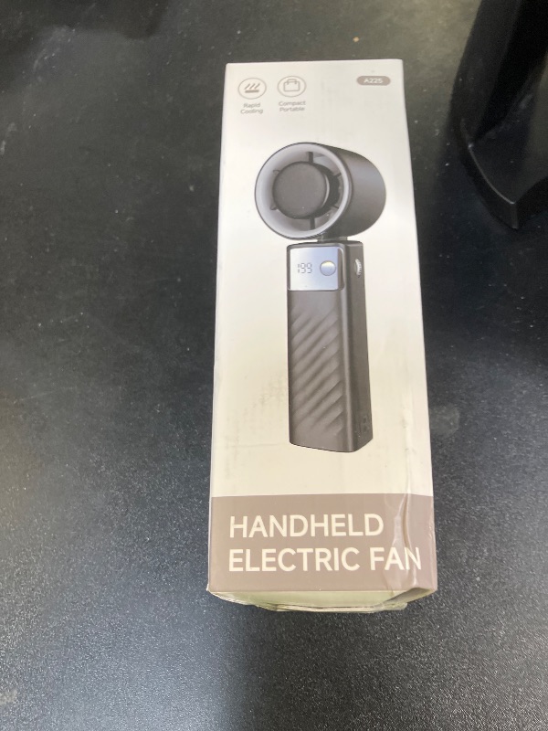 Photo 1 of YOSHENMO Portable Handheld Turbo Fan - Foldable Mini Fan with Air Turbo Tech, 1-199 Speed Adjustment, 20H Runtime, LED Display, Battery-Powered for Indoor/Outdoor Use, Dark Black