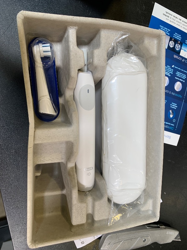 Photo 1 of Oral-B iO Simple Clean Rechargeable Electric Powered Toothbrush, Pure White with 1 Gentle Care Brush Head and 1 White Travel Case - Automatic Pressure Sensor to Protect Gums - 3 Modes -2 Min Timer