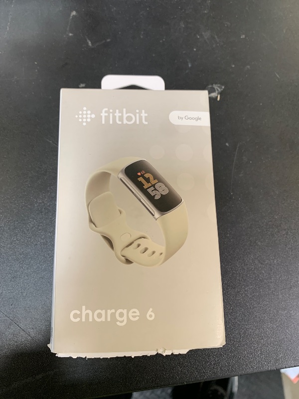 Photo 1 of Fitbit Charge 6 Fitness Tracker with Google apps, Heart Rate on Exercise Equipment, 6-Months Premium Membership Included, GPS, Health Tools and More, Porcelain/Silver, One Size (S & L Bands Included)