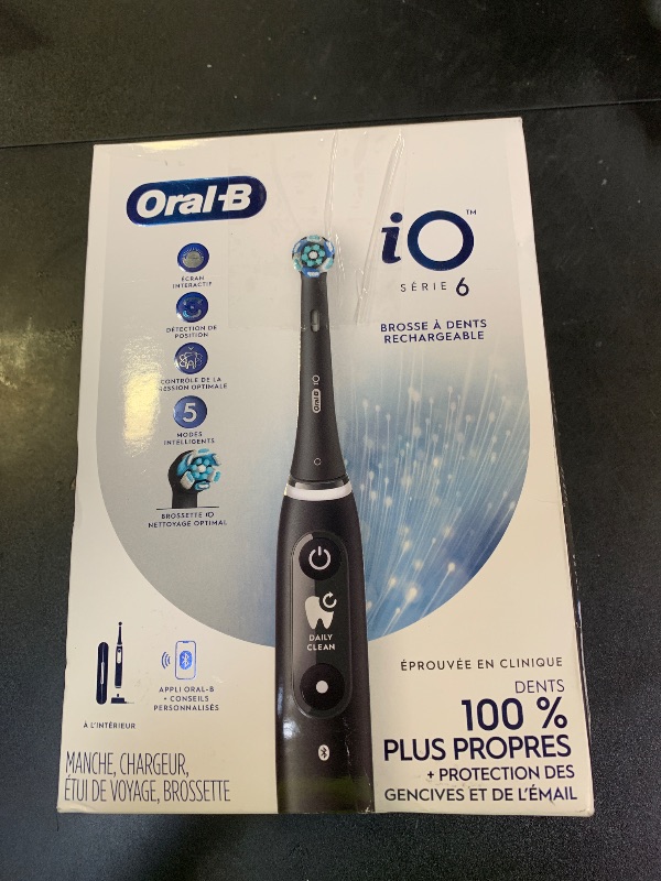 Photo 1 of Oral-B iO Series 6 Rechargeable Electric Toothbrush with Visible Pressure Sensor to Protect Gums, 2 Minute Timer, 5 Cleaning Settings, 1 Replacement Toothbrush Head, and Travel Case, Black