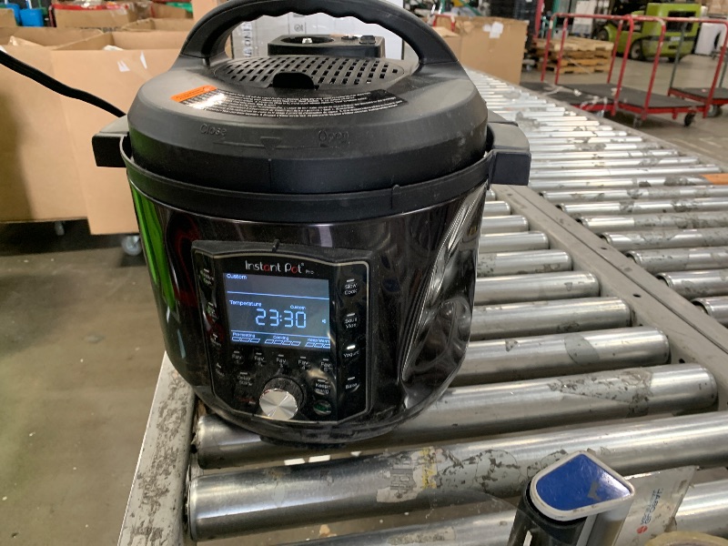 Photo 1 of DENTED SIDE Instant Pot Pro (8 QT) 10-in-1 Pressure Cooker, Slow Cooker, Rice/Grain Cooker, Steamer, Sauté, Sous Vide, Yogurt Maker, Sterilizer, and Warmer, Includes App With Over 800 Recipes, Black