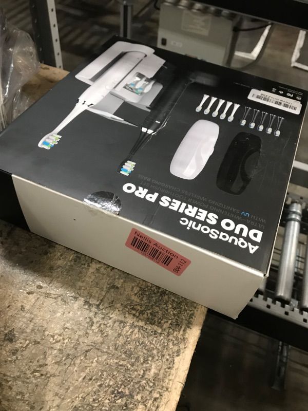 Photo 1 of AquaSonic DUO PRO – Ultra Whitening 40,000 VPM Electric ToothBrushes – ADA Accepted - 4 Modes with Smart Timers - UV Sanitizing & Wireless Charging Base - 10 ProFlex Brush Heads & 2 Travel Cases