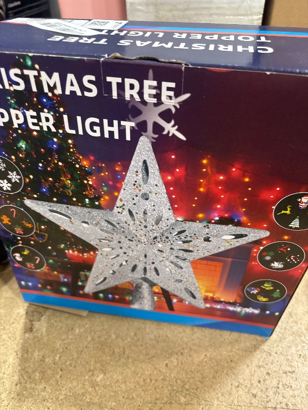 Photo 1 of DG-Direct Christmas Tree Topper Lighted Star with 6 Projected Patterns,3D Hollow Sparkling Star Christmas Tree Topper with Rotating Magic Projector for Christmas Tree Ornament