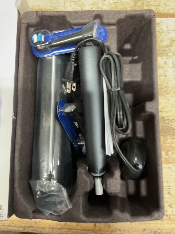 Photo 1 of Oral-B iO Deep Clean + Protect Rechargeable Electric Toothbrush, Black with a iO Series 7 Toothbrush, 2 Replacement Brush Heads, and a Charging Travel Case