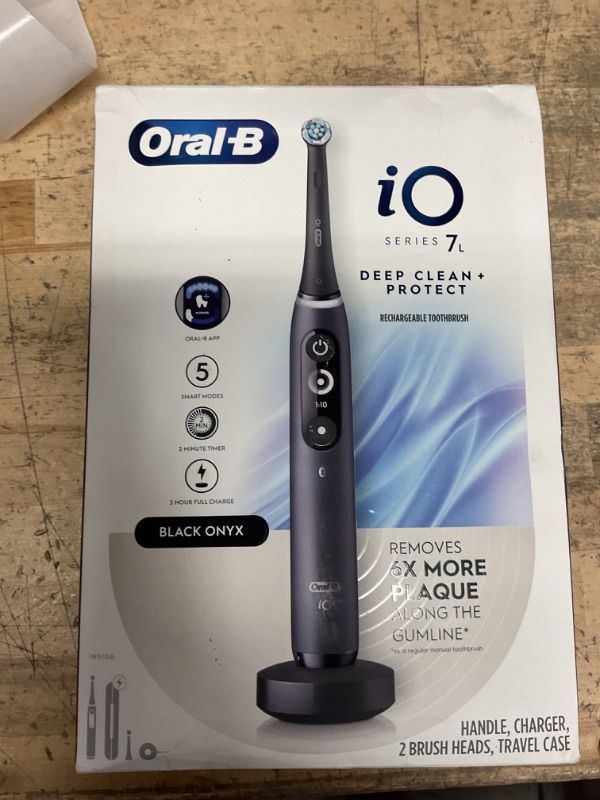 Photo 1 of Oral-B iO Deep Clean + Protect Rechargeable Electric Toothbrush, Black with a iO Series 7 Toothbrush, 2 Replacement Brush Heads, and a Charging Travel Case