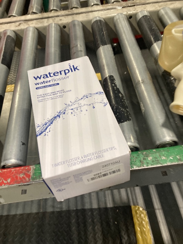 Photo 1 of Waterpik Cordless Pearl Rechargeable Portable Water Flosser for Teeth, Gums, Braces Care and Travel with 4 Flossing Tips - ADA Accepted, WF-13 Black, Packaging May Vary