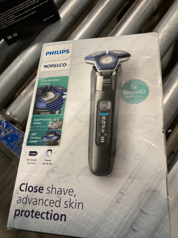 Photo 1 of *MISSING SEVERAL PIECES**Philips Norelco Shaver 7300, Rechargeable Wet & Dry Electric Shaver with SenseIQ Technology, Pop-up Trimmer, Charging Stand, Click-on Nose Trimmer, & Travel Case, S7887/92