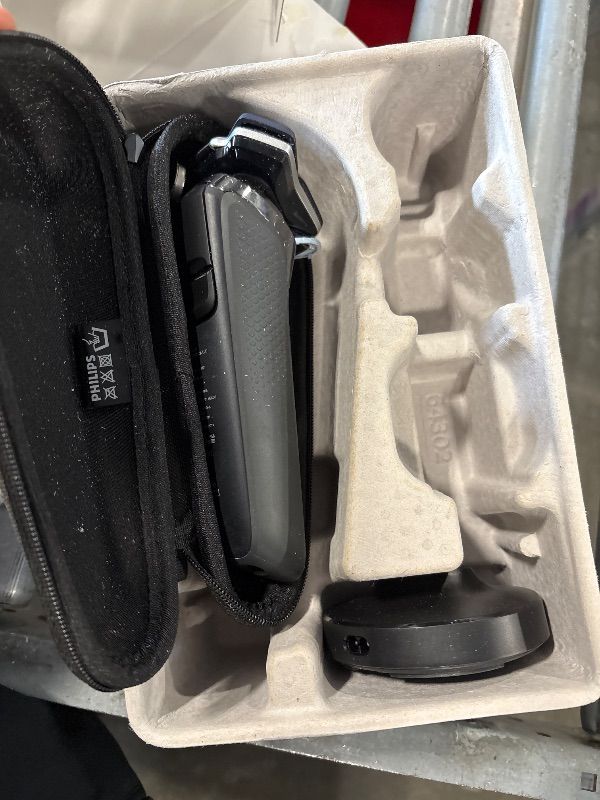 Photo 1 of *MISSING SEVERAL PIECES**Philips Norelco Shaver 7300, Rechargeable Wet & Dry Electric Shaver with SenseIQ Technology, Pop-up Trimmer, Charging Stand, Click-on Nose Trimmer, & Travel Case, S7887/92