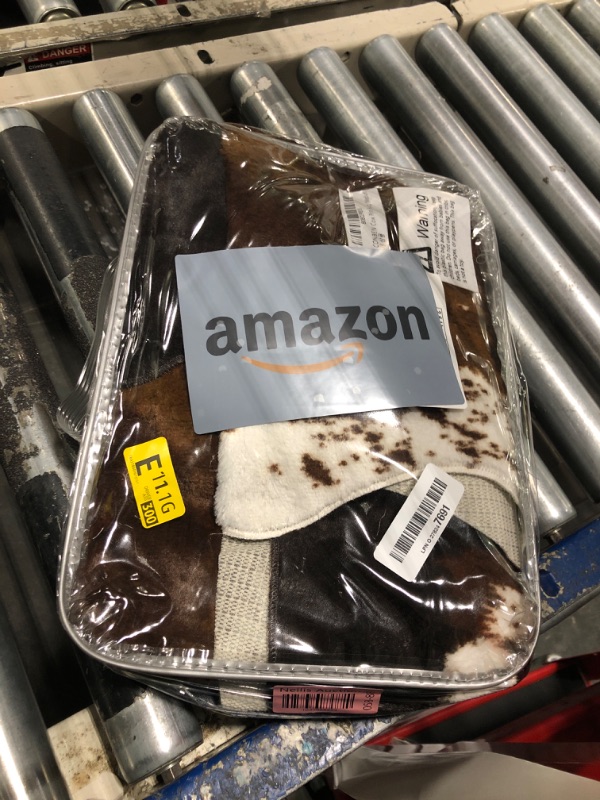 Photo 1 of Faux Fur Cowhide Rug 5 x 6.6 ft, Cow Print Area Rug Cute Animal Printed Carpets for Bedroom Living Room Rustic Western Home Decor, No Shedding and Easy to Clean