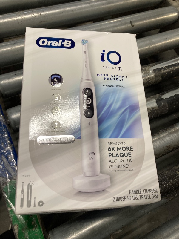 Photo 1 of Oral-B iO Deep Clean + Protect Rechargeable Electric Toothbrush, White with a iO Series 7 Toothbrush, 2 Replacement Brush Heads, and a Charging Travel Case