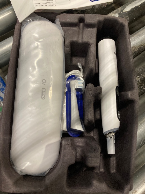 Photo 1 of Oral-B iO Deep Clean + Protect Rechargeable Electric Toothbrush, White with a iO Series 7 Toothbrush, 2 Replacement Brush Heads, and a Charging Travel Case