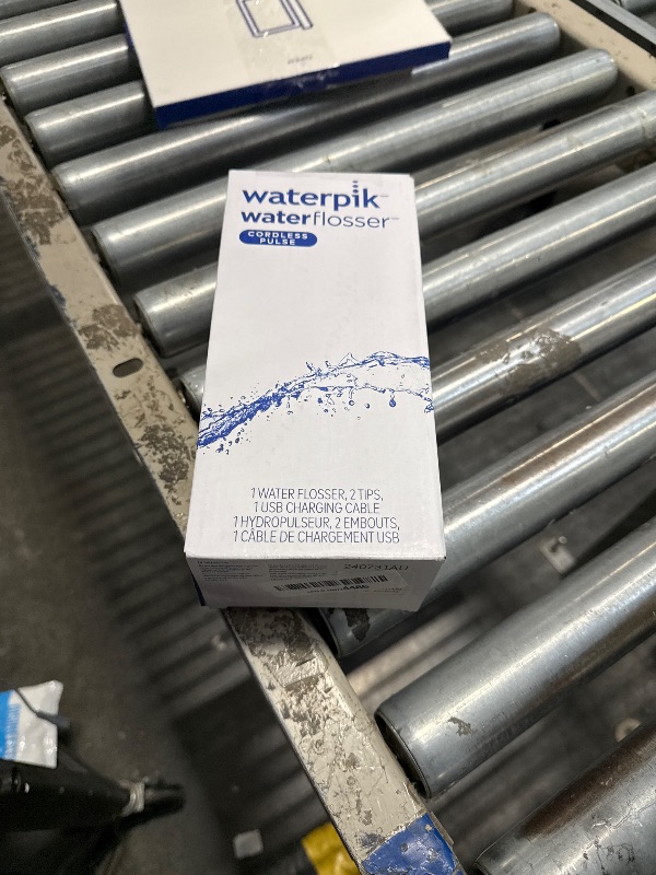 Photo 1 of Waterpik Cordless Pulse Rechargeable Portable Water Flosser for Teeth, Gums, Braces Care and Travel with 2 Flossing Tips, Waterproof, ADA Accepted, WF-20 Blue, Packaging May Vary