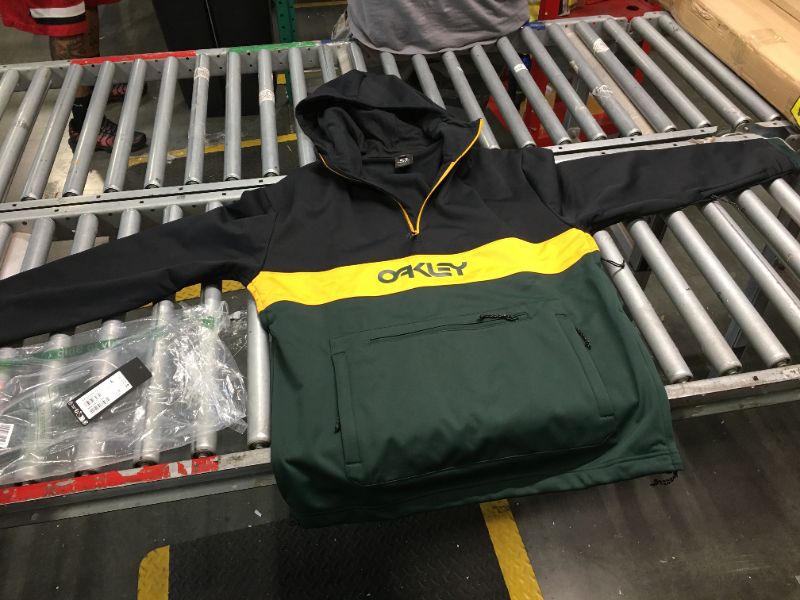 Photo 2 of ***Large size*** Oakley Men's Thermonuclear Protection Nose Grab Softshell Hoodie, Black/Hunter Green