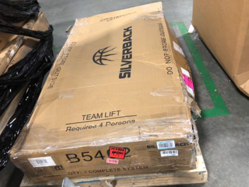 Photo 1 of Silverback 60" In-Ground Basketball System with Adjustable-Height Tempered Glass Backboard and Pro-Style Breakaway Rim