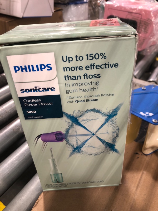 Photo 2 of Philips Sonicare Cordless Power Flosser 3000, Water Flosser with Innovative Quad Stream Technology, Oral Irrigator with 2 Flossing Modes and 3 Intensity Levels, Ergonomic Design, Mint, HX3826/24