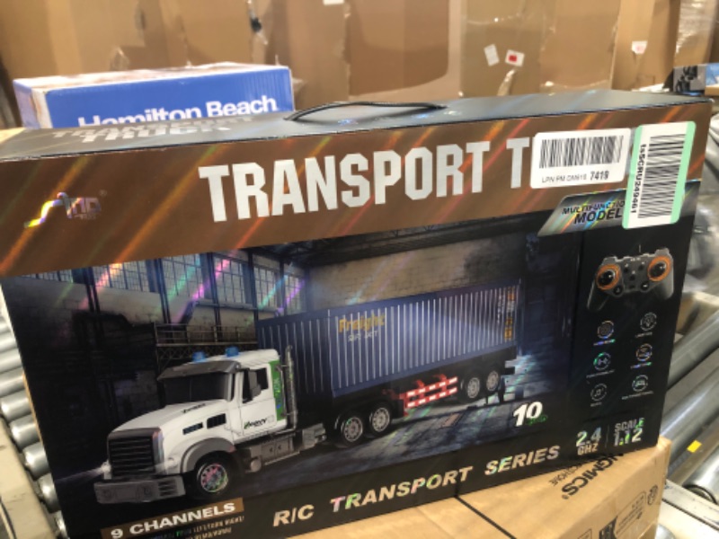 Photo 1 of Remote Control Semi Truck with Trailer - 23.6 Inch 9-Channel RC Semi Truck Toy for Kids, 1:24 Container Truck with 2 Batteries, Van Transport Vehicle with Lights & Music, Great Gift for Boys Girls