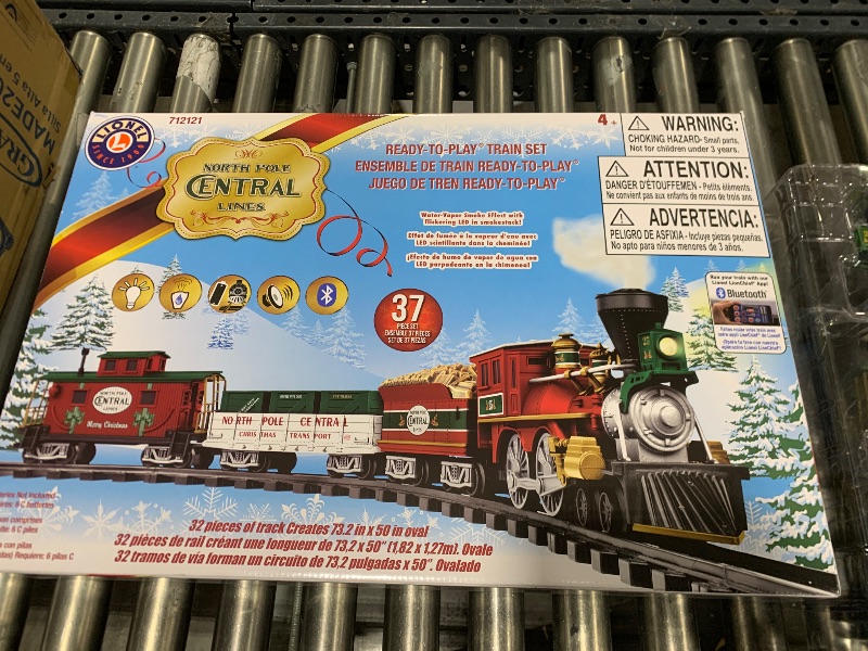 Photo 1 of Lionel Battery-Operated North Pole Central Freight Toy Train Set with Bluetooth, Locomotive, Train Cars, & Track with Authentic Train Sounds, Lights, & Water Vapor Smoke Effects for Kids 4+