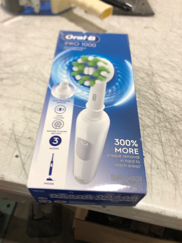 Photo 1 of Oral-B Pro 1000 Rechargeable Electric Toothbrush, White