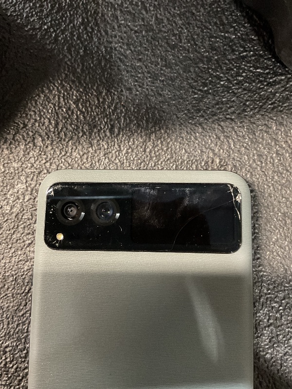 Photo 2 of **CRACKED FRONT GLASS BY CAMERA**
Motorola razr | 2023 | Unlocked | Made for US 8/128 | 32MP Camera | Sage Green, 73.95 x 170.82 x 7.35mm